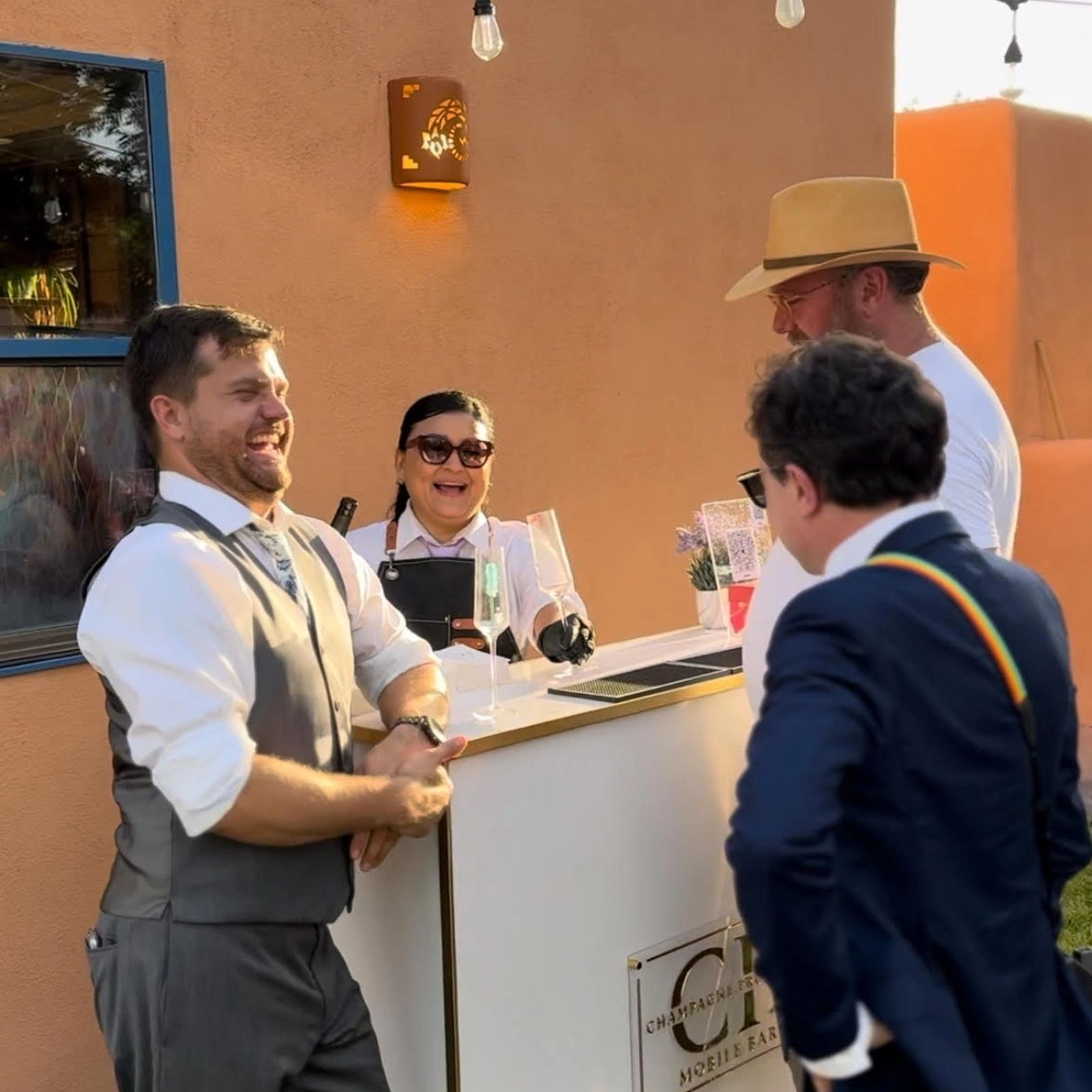 Bartenders serving guests in suits at a corporate reception